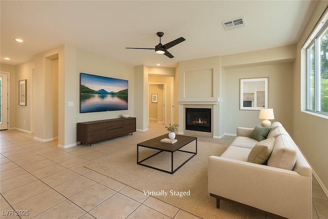10212 Donald Weese Ct, Las Vegas, NV 89129 - living area with light tile patterned floors, ceiling fan, a fireplace, recessed lighting, and baseboards