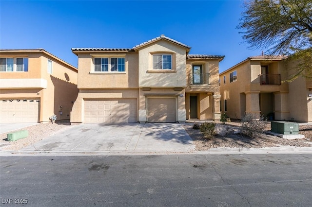 3774 Dusky Flycatcher St, Las Vegas, NV 89122 - view of front of property with a garage, stucco siding, a tile roof, and concrete driveway