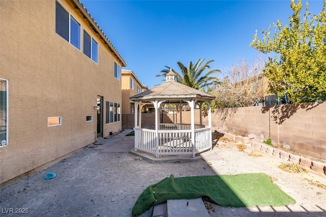 3774 Dusky Flycatcher St, Las Vegas, NV 89122 - fenced backyard featuring a gazebo and a patio