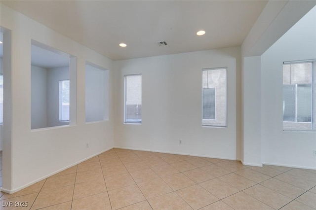 3774 Dusky Flycatcher St, Las Vegas, NV 89122 - empty room with plenty of natural light, light tile patterned floors, recessed lighting, and baseboards
