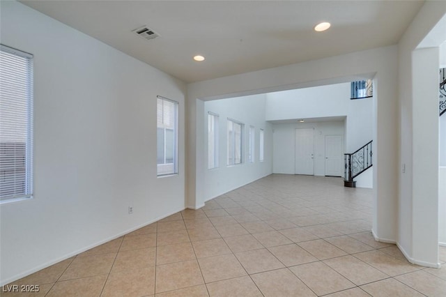 3774 Dusky Flycatcher St, Las Vegas, NV 89122 - spare room with stairway, light tile patterned flooring, recessed lighting, and baseboards