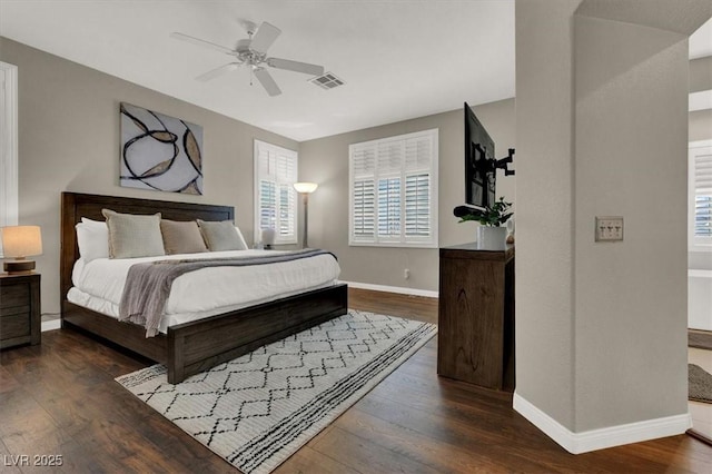 bedroom featuring wood finished floors, baseboards, and a ceiling fan