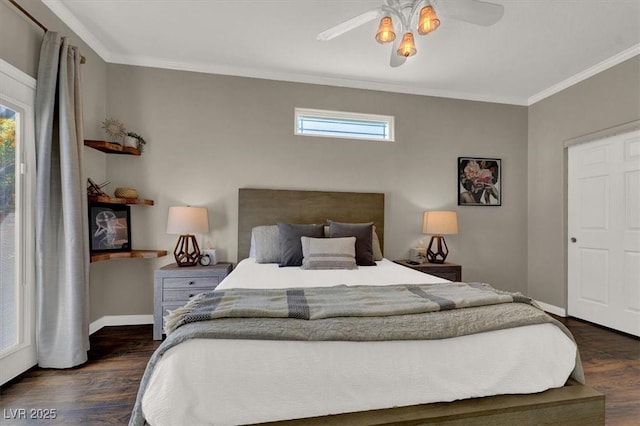 bedroom featuring wood finished floors, ornamental molding, baseboards, and a ceiling fan