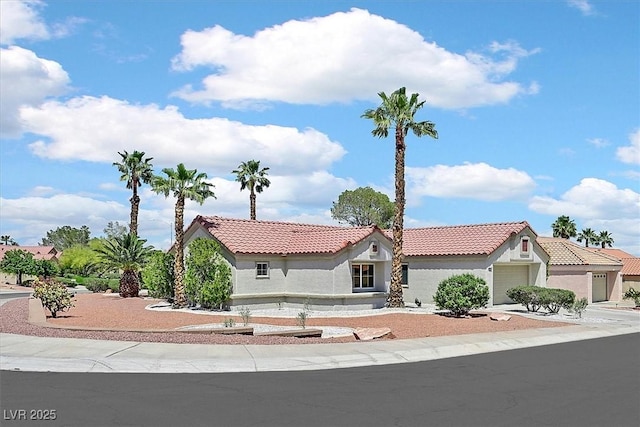 9552 Gold Bank Dr, Las Vegas, NV 89134 - mediterranean / spanish-style house featuring a tile roof, stucco siding, and an attached garage