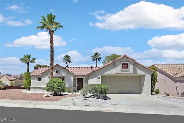 9552 Gold Bank Dr, Las Vegas, NV 89134 - mediterranean / spanish-style house featuring a tile roof, stucco siding, concrete driveway, and an attached garage