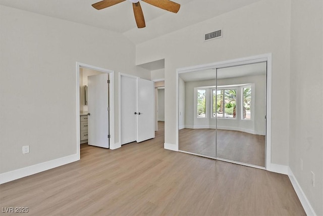 9552 Gold Bank Dr, Las Vegas, NV 89134 - unfurnished bedroom featuring wood finished floors, ensuite bathroom, a ceiling fan, and high vaulted ceiling