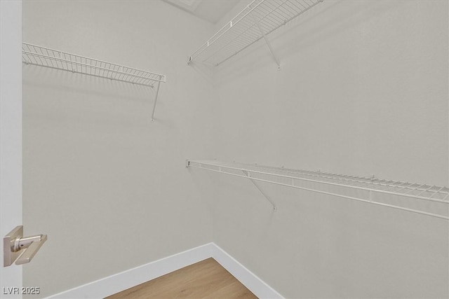 9552 Gold Bank Dr, Las Vegas, NV 89134 - spacious closet featuring light wood finished floors