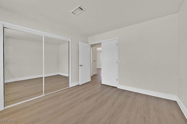 9552 Gold Bank Dr, Las Vegas, NV 89134 - unfurnished bedroom with wood finished floors and a closet