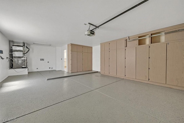 9552 Gold Bank Dr, Las Vegas, NV 89134 - garage featuring a garage door opener and heating unit