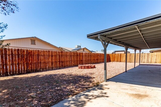 fenced backyard with a patio area