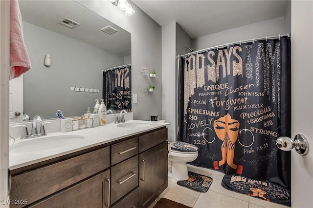 253 Kindly Way, Henderson, NV 89011 - full bathroom featuring toilet, tile patterned flooring, double vanity, and curtained shower