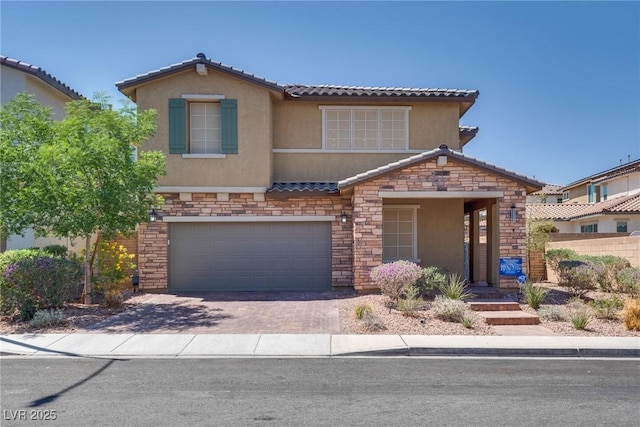 253 Kindly Way, Henderson, NV 89011 - view of front of house featuring stone siding, stucco siding, a garage, and a tile roof