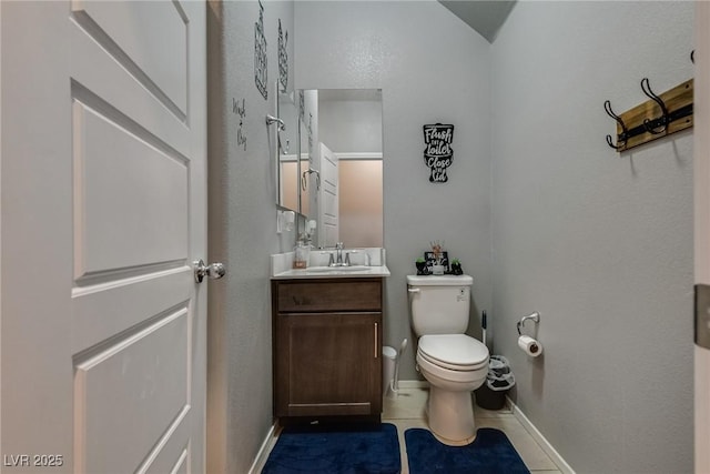 253 Kindly Way, Henderson, NV 89011 - half bath featuring vanity, baseboards, toilet, and tile patterned flooring