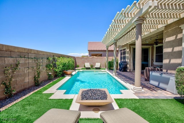 view of pool with a ceiling fan, a pergola, and a patio area