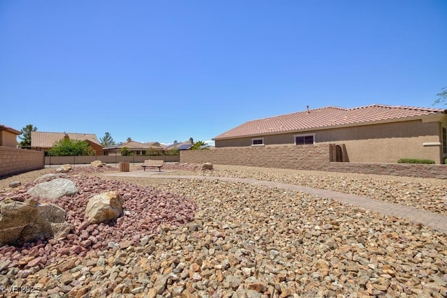 view of yard with fence and a patio