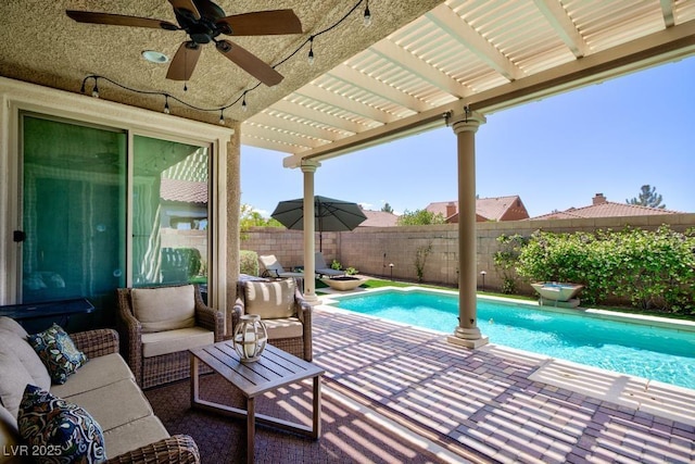 view of swimming pool featuring a fenced backyard, a ceiling fan, a pergola, and a patio