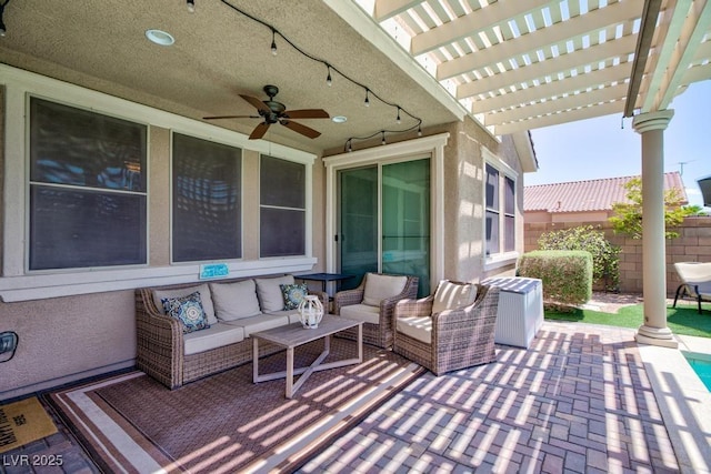 view of patio featuring an outdoor hangout area, a pergola, fence, and a ceiling fan