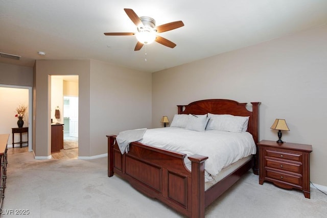 bedroom featuring light colored carpet, baseboards, and ceiling fan