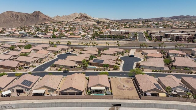 aerial overview of property's location featuring nearby suburban area and mountains