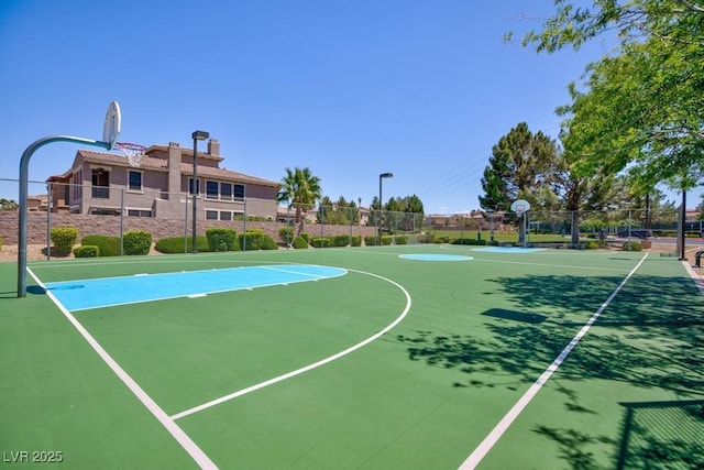 view of sport court featuring community basketball court and fence