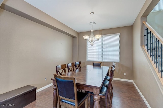 3440 Bella Viera Ct, Las Vegas, NV 89141 - dining area with baseboards, wood finished floors, a chandelier, and stairs