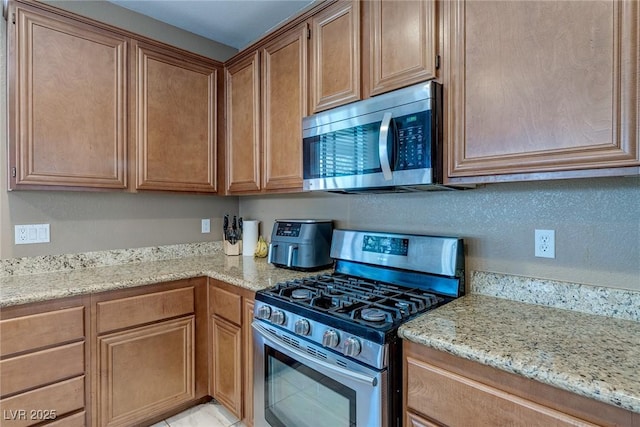 3440 Bella Viera Ct, Las Vegas, NV 89141 - kitchen featuring stainless steel appliances and light stone counters