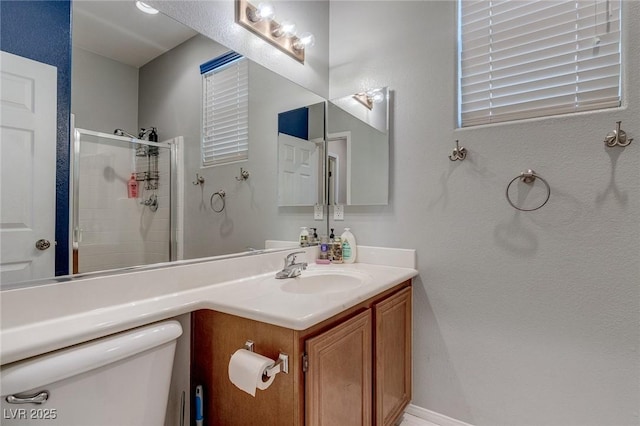 3440 Bella Viera Ct, Las Vegas, NV 89141 - bathroom featuring a stall shower, toilet, and vanity