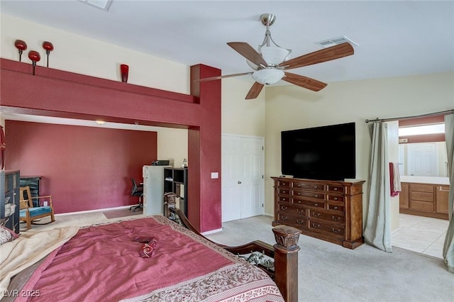 3440 Bella Viera Ct, Las Vegas, NV 89141 - bedroom with light colored carpet, a ceiling fan, and ensuite bath