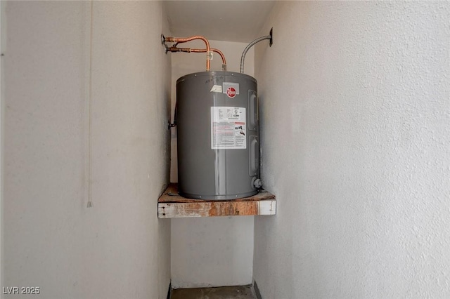 utility room featuring water heater