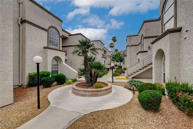 surrounding community featuring stairs and a residential view