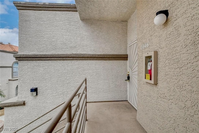 laundry area with light carpet