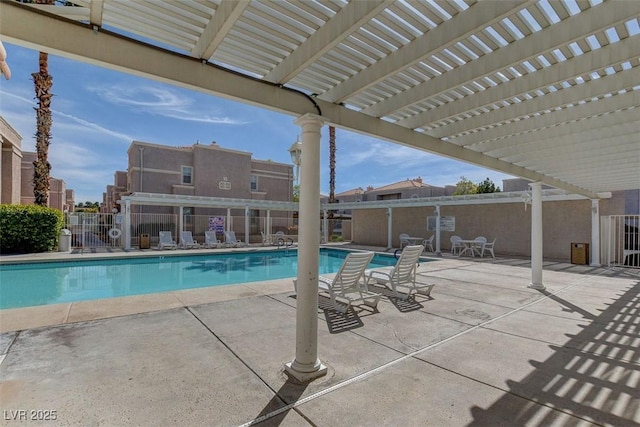 community pool featuring a pergola and fence