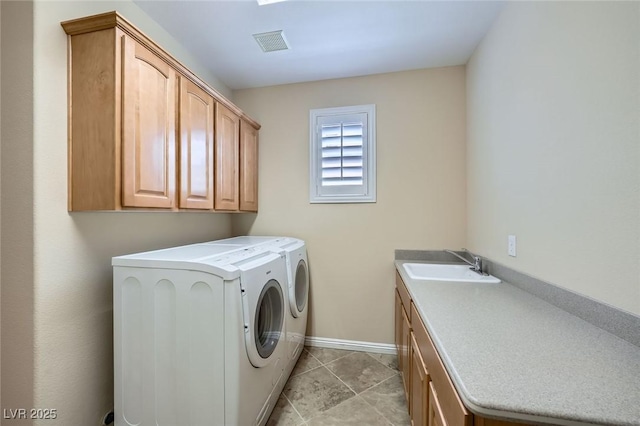 4552 Largo Cantata St, Las Vegas, NV 89135 - clothes washing area with cabinet space, washing machine and dryer, and baseboards
