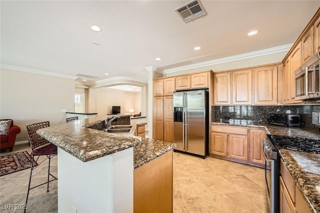 4552 Largo Cantata St, Las Vegas, NV 89135 - kitchen with stainless steel appliances, ornamental molding, a sink, recessed lighting, and a breakfast bar area