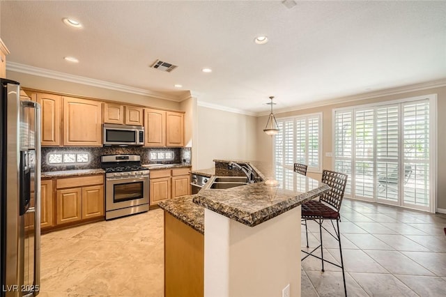 4552 Largo Cantata St, Las Vegas, NV 89135 - kitchen featuring stainless steel appliances, a kitchen breakfast bar, decorative backsplash, a sink, and crown molding