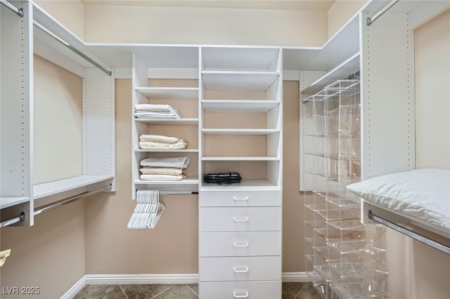 4552 Largo Cantata St, Las Vegas, NV 89135 - spacious closet with dark tile patterned floors
