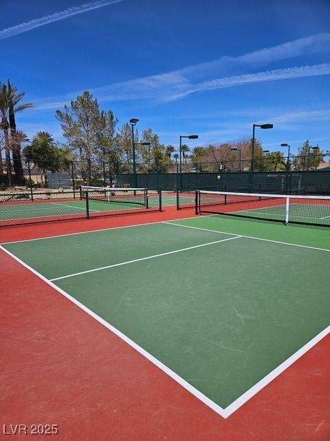 4552 Largo Cantata St, Las Vegas, NV 89135 - view of tennis court with community basketball court and fence