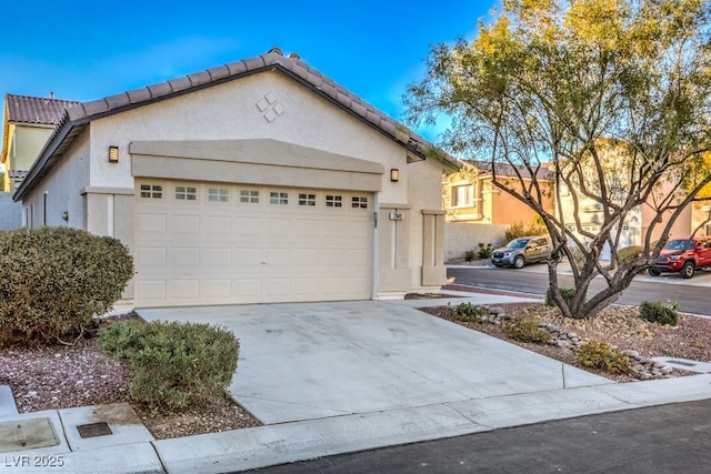 7849 Montour Falls St, Las Vegas, NV 89149 - view of front of house featuring stucco siding, driveway, and an attached garage