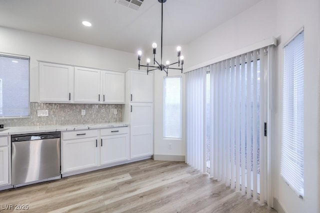 7849 Montour Falls St, Las Vegas, NV 89149 - kitchen featuring dishwasher, a chandelier, decorative backsplash, and white cabinetry