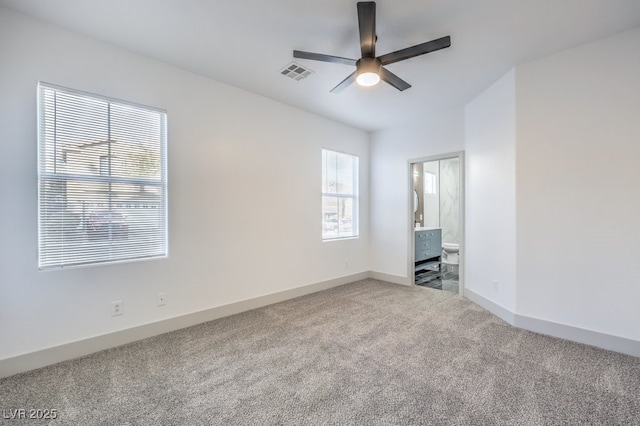 7849 Montour Falls St, Las Vegas, NV 89149 - unfurnished bedroom with carpet floors, baseboards, ensuite bathroom, and a ceiling fan