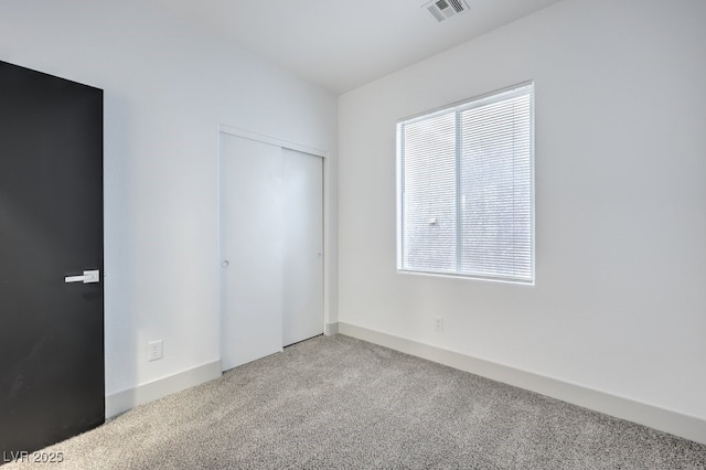 7849 Montour Falls St, Las Vegas, NV 89149 - unfurnished bedroom with carpet flooring, a closet, and baseboards