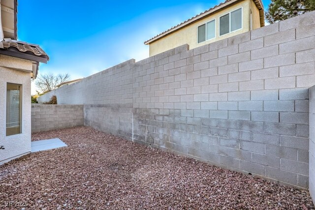 7849 Montour Falls St, Las Vegas, NV 89149 - exterior view of a fenced backyard and stucco siding