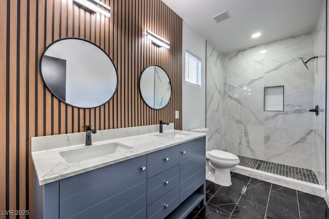 7849 Montour Falls St, Las Vegas, NV 89149 - full bathroom with marble finish floors, toilet, wallpapered walls, double vanity, and a marble finish shower