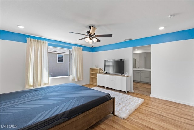bedroom featuring wood finished floors, recessed lighting, baseboards, and ceiling fan