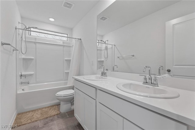 bathroom featuring toilet, shower / tub combo with curtain, double vanity, and baseboards