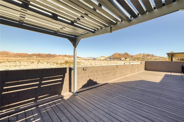 wooden deck with a mountain view