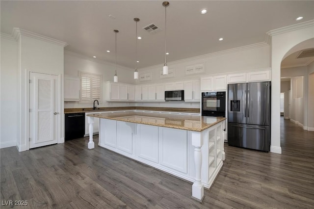 kitchen with black appliances, arched walkways, white cabinetry, a spacious island, and dark wood-type flooring