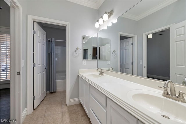 full bathroom featuring ornamental molding, baseboards, tile patterned floors, double vanity, and bathtub / shower combination