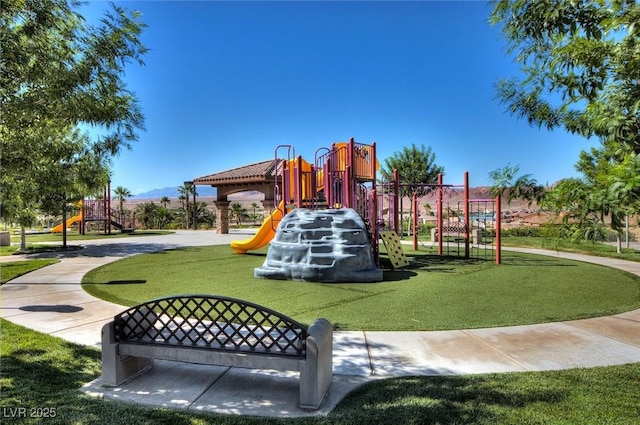 community jungle gym with a lawn