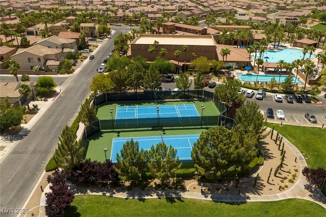 aerial perspective of suburban area featuring a pool
